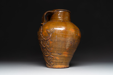 Three German stoneware jugs, including a bellarmine, and a French or English pottery jug, 17th C. and later