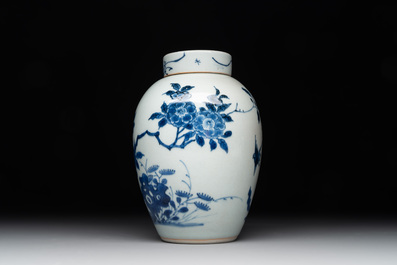 A Chinese blue and white jar and cover with birds among flowering branches, Transitional period