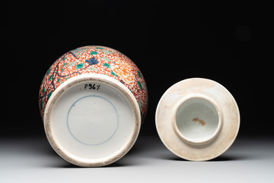 A pair of Chinese famille verte 'phoenix' vases and covers, 19th C.