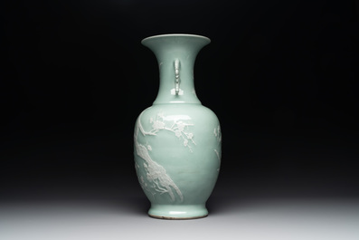 A Chinese slip-decorated celadon-glazed vase with floral design, Qianlong mark and of the period