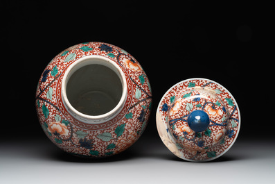 A pair of Chinese famille verte 'phoenix' vases and covers, 19th C.