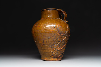 Three German stoneware jugs, including a bellarmine, and a French or English pottery jug, 17th C. and later