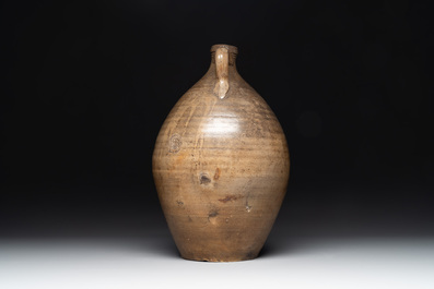 Three German stoneware jugs, including a bellarmine, and a French or English pottery jug, 17th C. and later