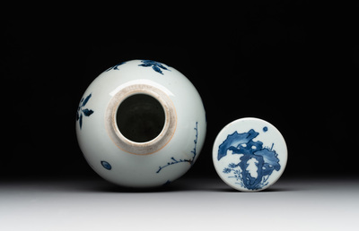 A Chinese blue and white jar and cover with birds among flowering branches, Transitional period