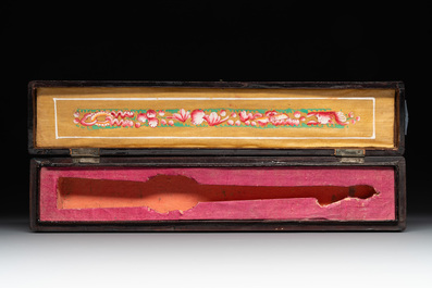 Two Chinese Canton gilt-lacquered and painted paper fans, one with original box, 19th C.