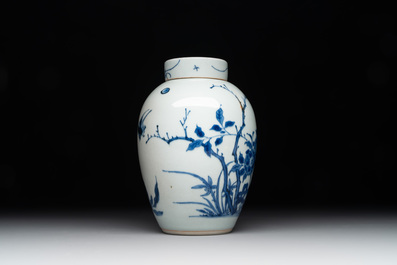 A Chinese blue and white jar and cover with birds among flowering branches, Transitional period