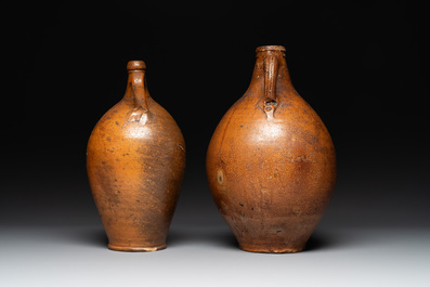 Three German stoneware jugs, including a bellarmine, and a French or English pottery jug, 17th C. and later
