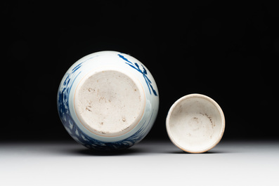 A Chinese blue and white jar and cover with birds among flowering branches, Transitional period
