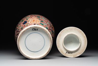 A pair of Chinese famille verte 'phoenix' vases and covers, 19th C.