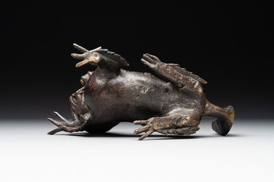 A rare Chinese bronze lion-form incense burner and cover, Song/Ming