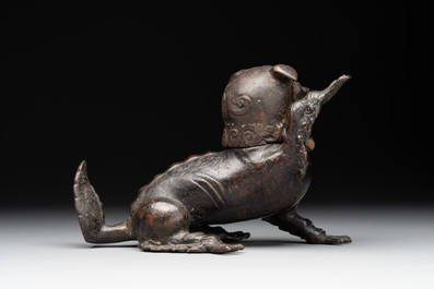 A rare Chinese bronze lion-form incense burner and cover, Song/Ming