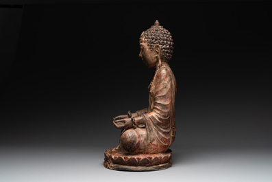 A Southeast Asian gilt-lacquered wooden sculpture of a praying ascetic, 18/19th C.