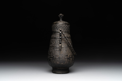 A Chinese archaistic bronze 'Taotie' wine vessel and cover, 'you 卣', Ming