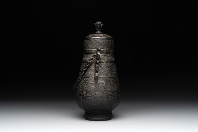 A Chinese archaistic bronze 'Taotie' wine vessel and cover, 'you 卣', Ming