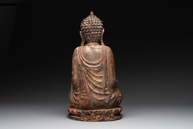 A Southeast Asian gilt-lacquered wooden sculpture of a praying ascetic, 18/19th C.