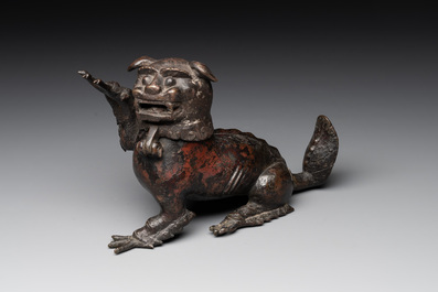 A rare Chinese bronze lion-form incense burner and cover, Song/Ming