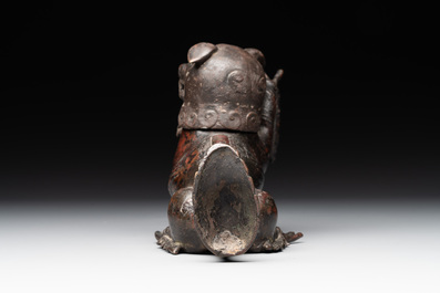 A rare Chinese bronze lion-form incense burner and cover, Song/Ming