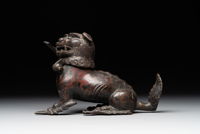 A rare Chinese bronze lion-form incense burner and cover, Song/Ming