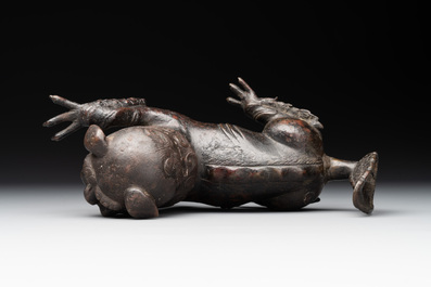 A rare Chinese bronze lion-form incense burner and cover, Song/Ming