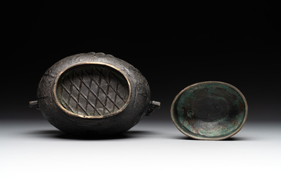 A Chinese archaistic bronze 'Taotie' wine vessel and cover, 'you 卣', Ming