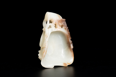 A Chinese white and russet jade lotus-form brush washer and two covered vases, Qing