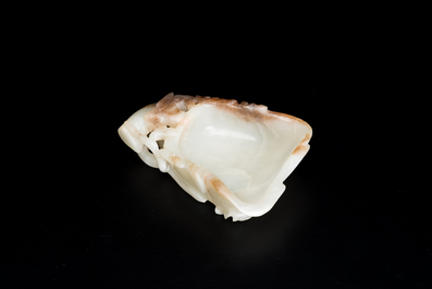 A Chinese white and russet jade lotus-form brush washer and two covered vases, Qing