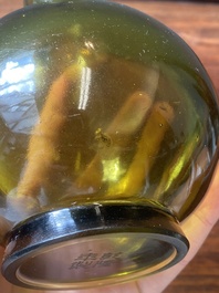 A rare Chinese translucent green Peking glass bottle vase, Qianlong mark and of the period