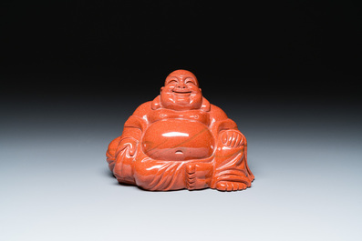 A Chinese emerald green jadeite 'birds' group, a goldstone Buddha, a carnelian group and two censers, 19/20th C.
