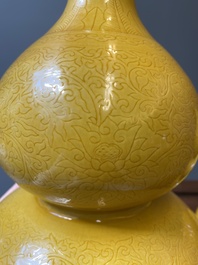 Two Chinese incised yellow-glazed triple gourd vases with dragons and lotus scrolls, Longqing mark, 20th C.