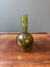A rare Chinese translucent green Peking glass bottle vase, Qianlong mark and of the period