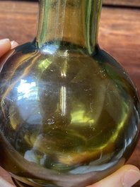 A rare Chinese translucent green Peking glass bottle vase, Qianlong mark and of the period
