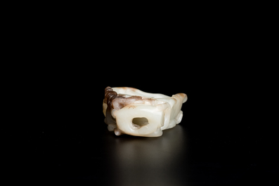 A Chinese white and russet jade lotus-form brush washer and two covered vases, Qing