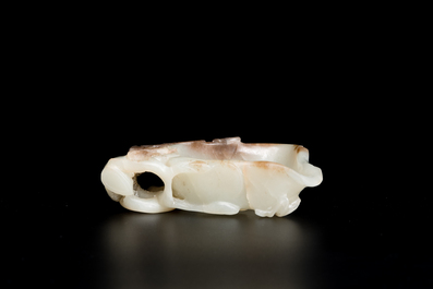 A Chinese white and russet jade lotus-form brush washer and two covered vases, Qing