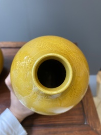 Two Chinese incised yellow-glazed triple gourd vases with dragons and lotus scrolls, Longqing mark, 20th C.