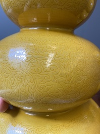 Two Chinese incised yellow-glazed triple gourd vases with dragons and lotus scrolls, Longqing mark, 20th C.