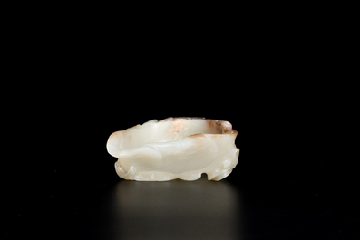 A Chinese white and russet jade lotus-form brush washer and two covered vases, Qing