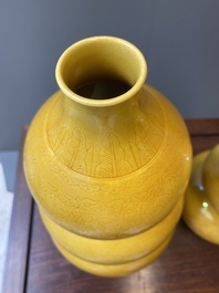 Two Chinese incised yellow-glazed triple gourd vases with dragons and lotus scrolls, Longqing mark, 20th C.