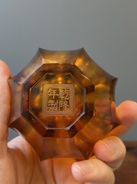 A Chinese facetted translucent amber-coloured Peking glass bottle vase, Qianlong mark, 19th C.