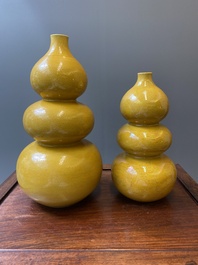 Two Chinese incised yellow-glazed triple gourd vases with dragons and lotus scrolls, Longqing mark, 20th C.