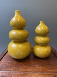 Two Chinese incised yellow-glazed triple gourd vases with dragons and lotus scrolls, Longqing mark, 20th C.
