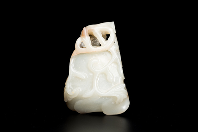 A Chinese white and russet jade lotus-form brush washer and two covered vases, Qing