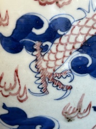 A Chinese blue, white and copper-red 'dragon and phoenix' vase, 19th C.