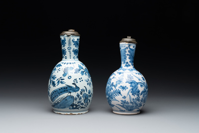 Two Dutch Delft blue and white jugs with pewter lids, 17/18th C.