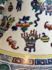 A Chinese doucai 'antiquities' 'hu' vase, Qianlong mark, 19th C.