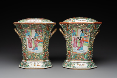 A pair of Chinese Canton famille rose flower holders and covers with figural design, 19th C.