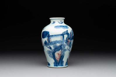 A Chinese blue, white and copper-red 'kylin and phoenix' vase, 19th C.