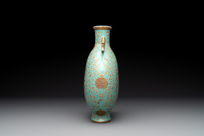 A Chinese gilt-decorated famille rose turquoise 'monkeys' and 'dogs' moon flask, Qianlong mark, 20th C.