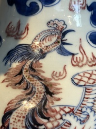 A Chinese blue, white and copper-red 'dragon and phoenix' vase, 19th C.