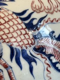 A Chinese blue, white and copper-red 'dragon and phoenix' vase, 19th C.