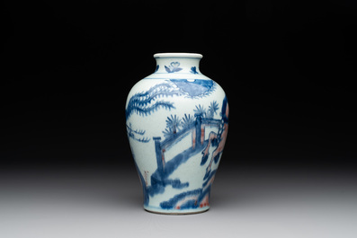 A Chinese blue, white and copper-red 'kylin and phoenix' vase, 19th C.